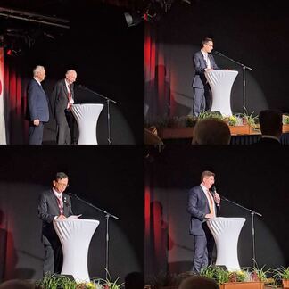 写真：式典で挨拶をする両市関係者の様子